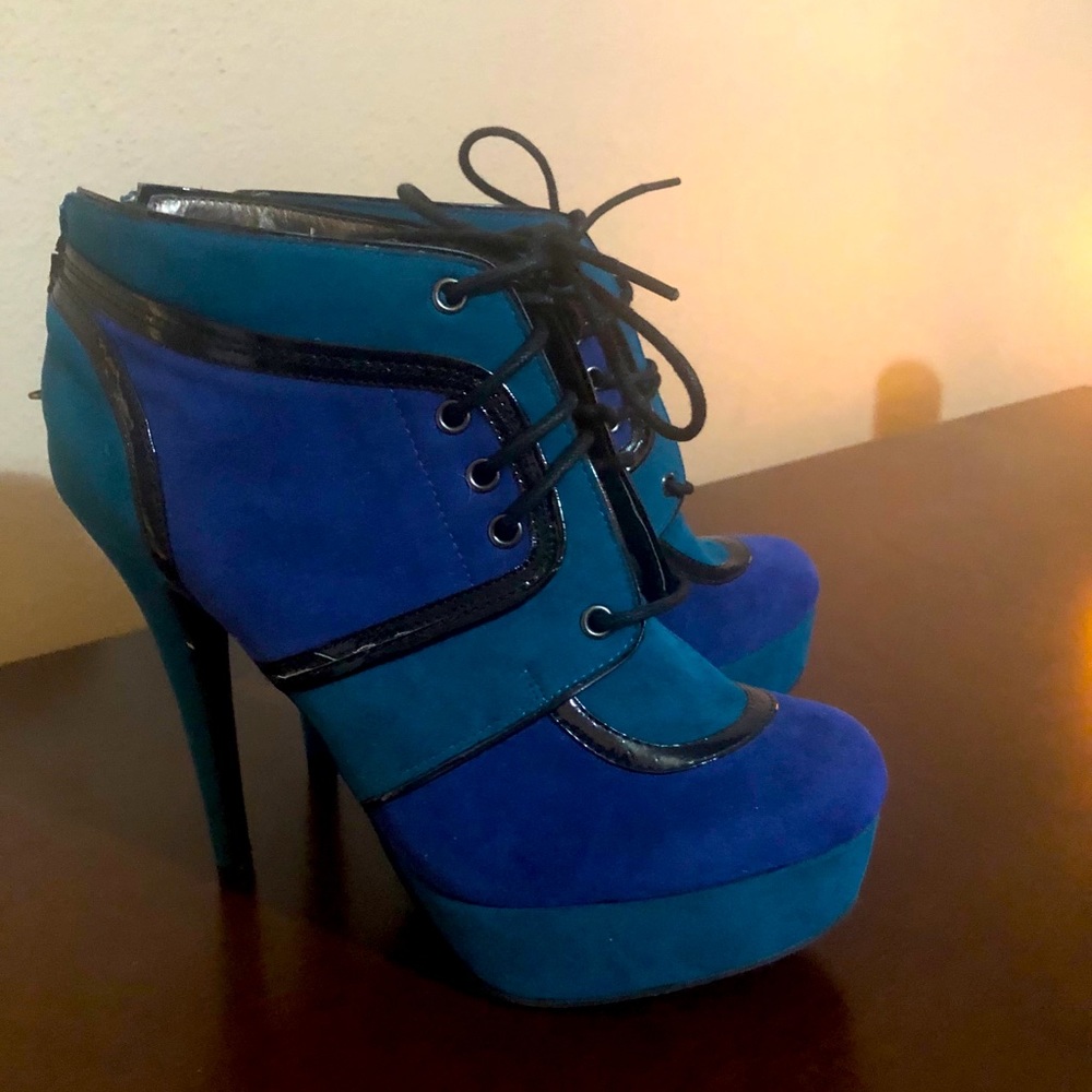 Teal and blue heeled boot with lace up.